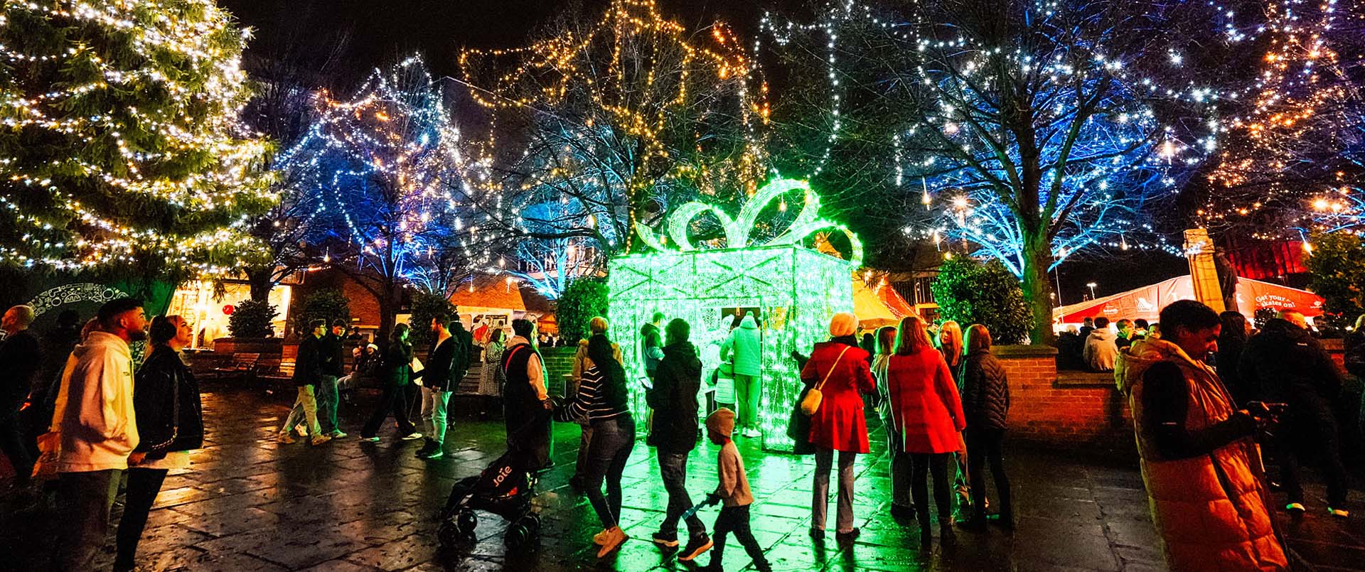 people interacting with Derby's Christmas light displays in the Market Place