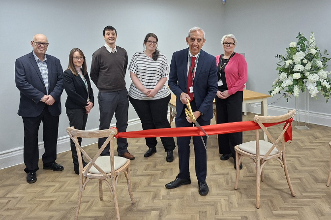 Cllr Hardyal Dhindsa cuts a red ribbon to mark the official launch of the Registration Services