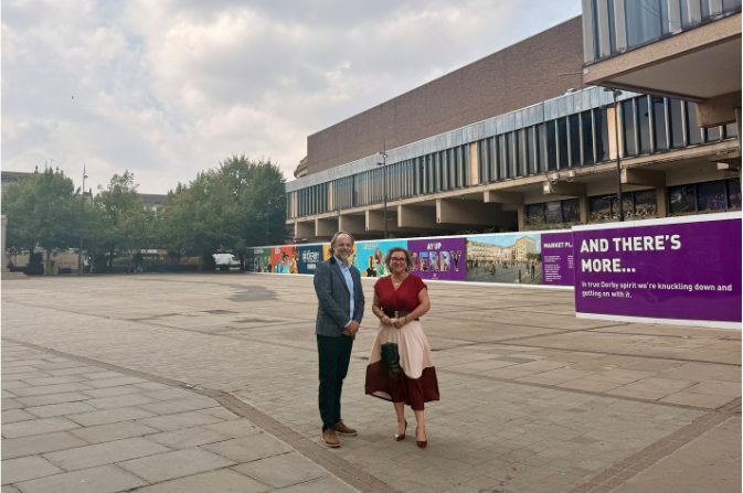 Andrew Webster, VINCI UK Developments, and Cllr Nadine Peatfield, Leader of the Council stood on the Market Place