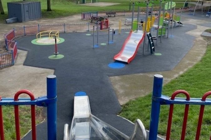 a playground viewed from the top of a slide