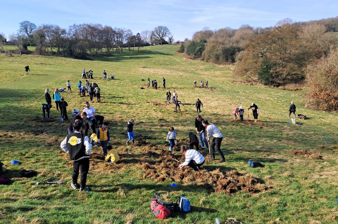Lots of people digging and working on parkland