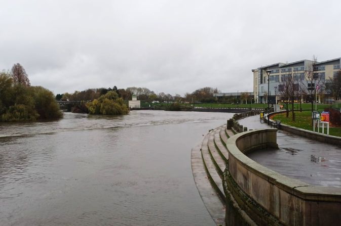 High water levels in a river. The sky is grey