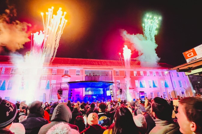 Fireworks go off around the stage at the Christmas Lights Switch On event