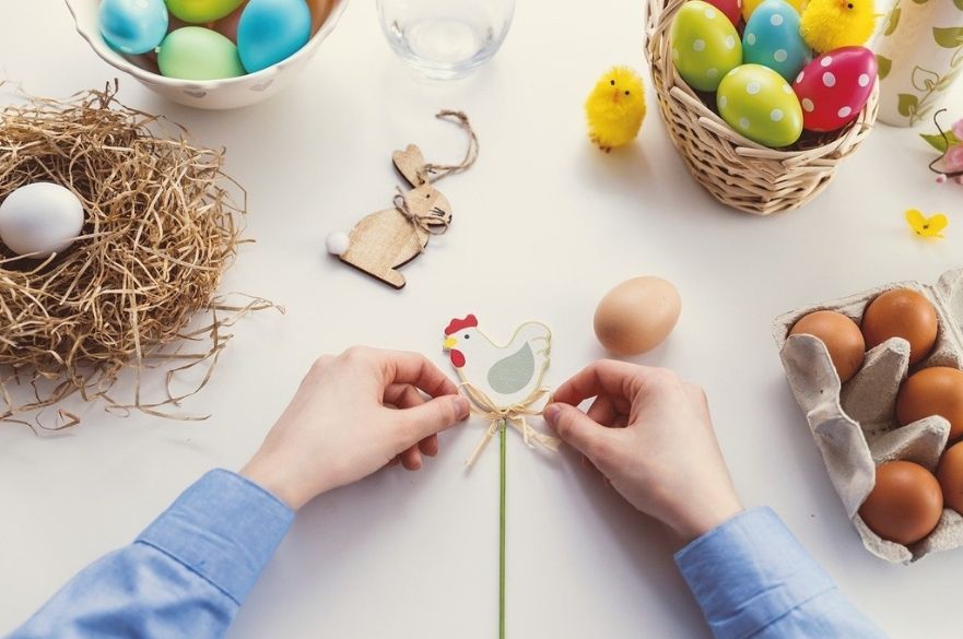 person creating easter decorations.