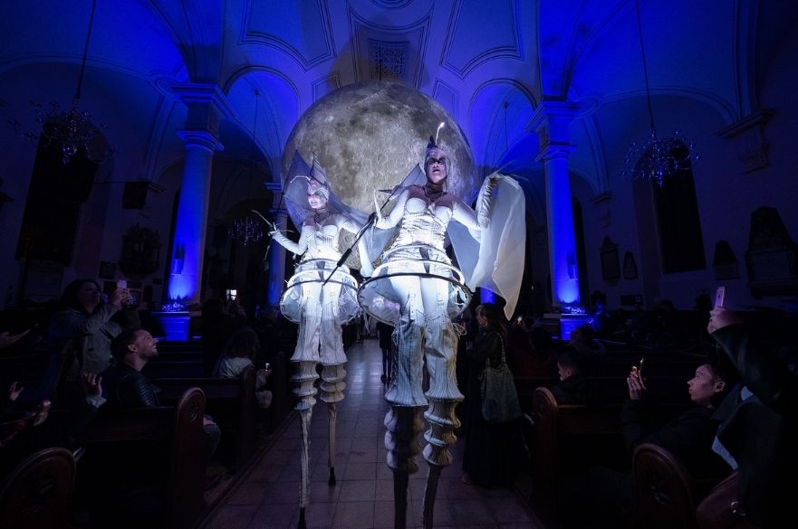 Closing act entering Derby Cathedral in front of model of the Moon at Feste 2019. Photo by Graham Whitmore