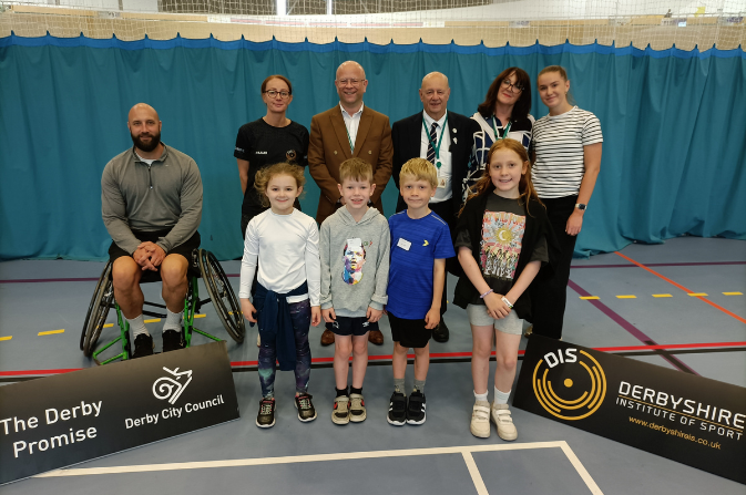 Children taking part in the Festival of Sport pictured with representatives of Derby County Council and Derbyshire Institute of Sport
