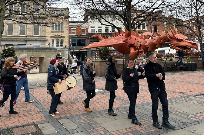 Musicians and the 'dragon' take part in celebrations for St George's Day 2023
