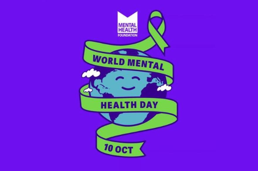 A World Mental Health Day graphic featuring a smiling globe wrapped in a green ribbon on a purple background.