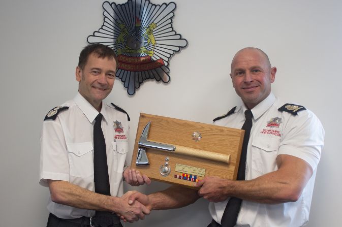 Two Fire chiefs with ceremonial axe