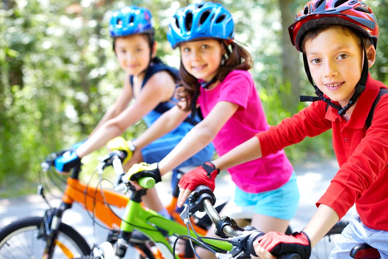 three children on bikes