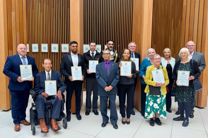 The 24/25 civic award winners stood with their awards