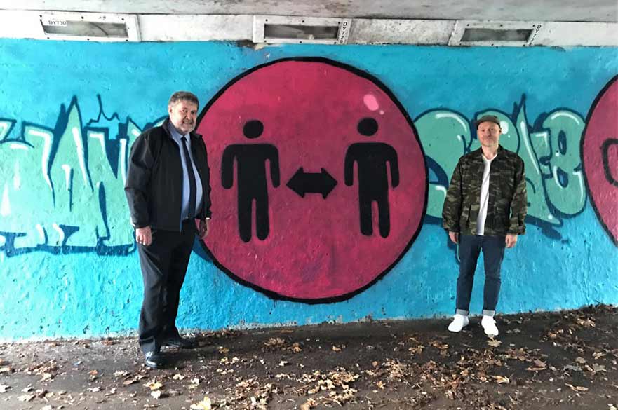 Councillor Poulter with Graffiti artist and COVID mural