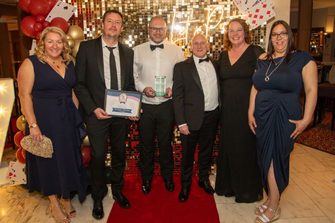 Members of the Derby LIVE team hold their award for the Public's Business of the Year