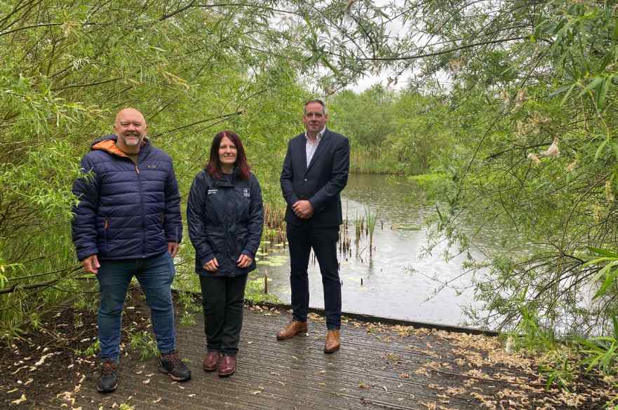 Cllr Jerry Pearce with Lisa Witham from Derbyshire Wildlife Trust and Nigel Dolan from Goodman at Derwent Meadows Nature Reserve