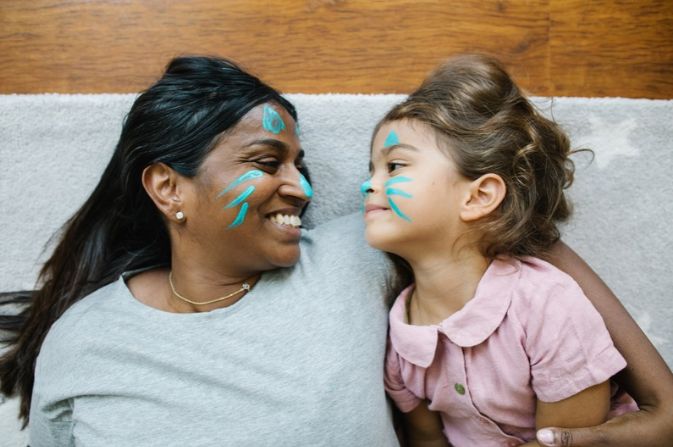 DfE image of woman and child with face painting