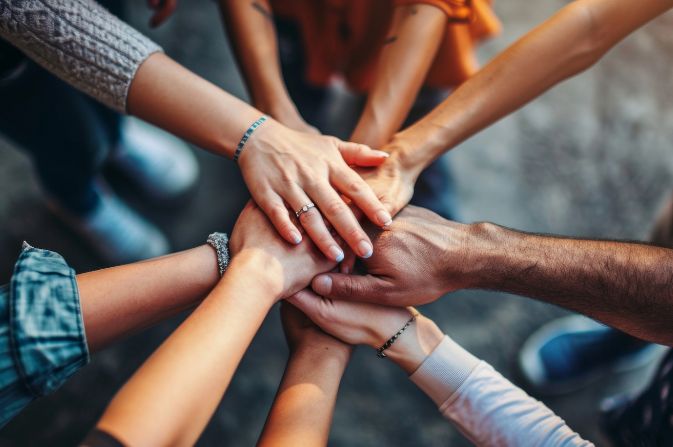 A group of hands touching together