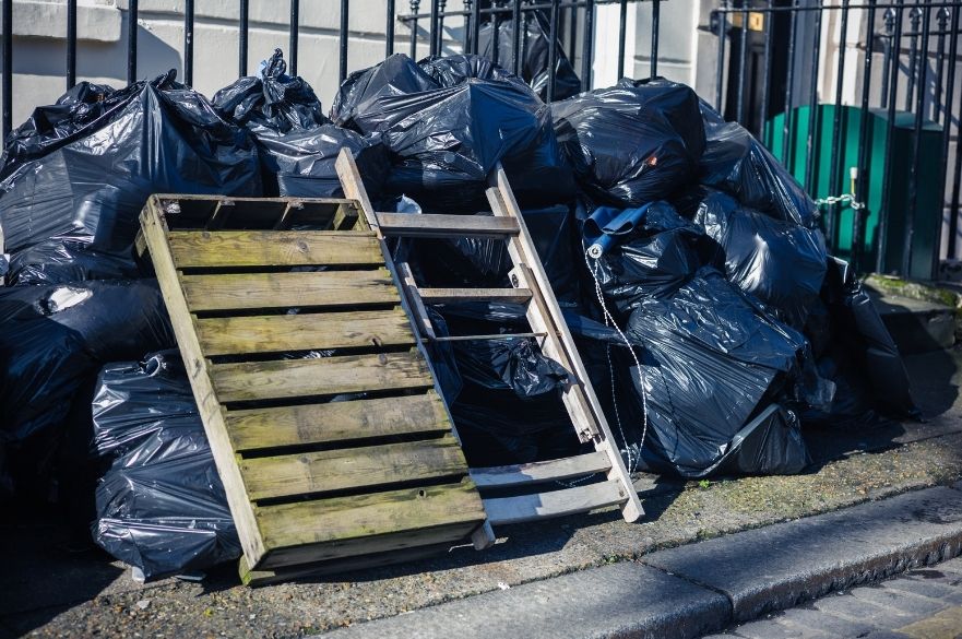 Pile of rubbish dumped outside building